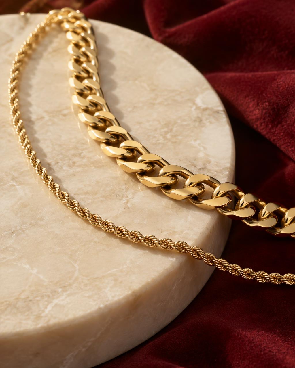 Illustrative close-up of gold chain links on a stone surface
